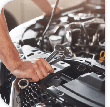 Technician servicing a vehicle